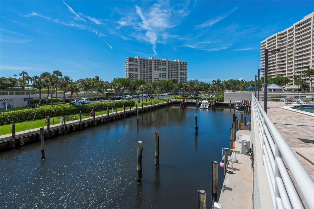 4201 North Ocean Boulevard, Unit 203 Boca Raton, FL 33431 - Photo 37 of 54 a view of swimming pool with outdoor seating and lake view