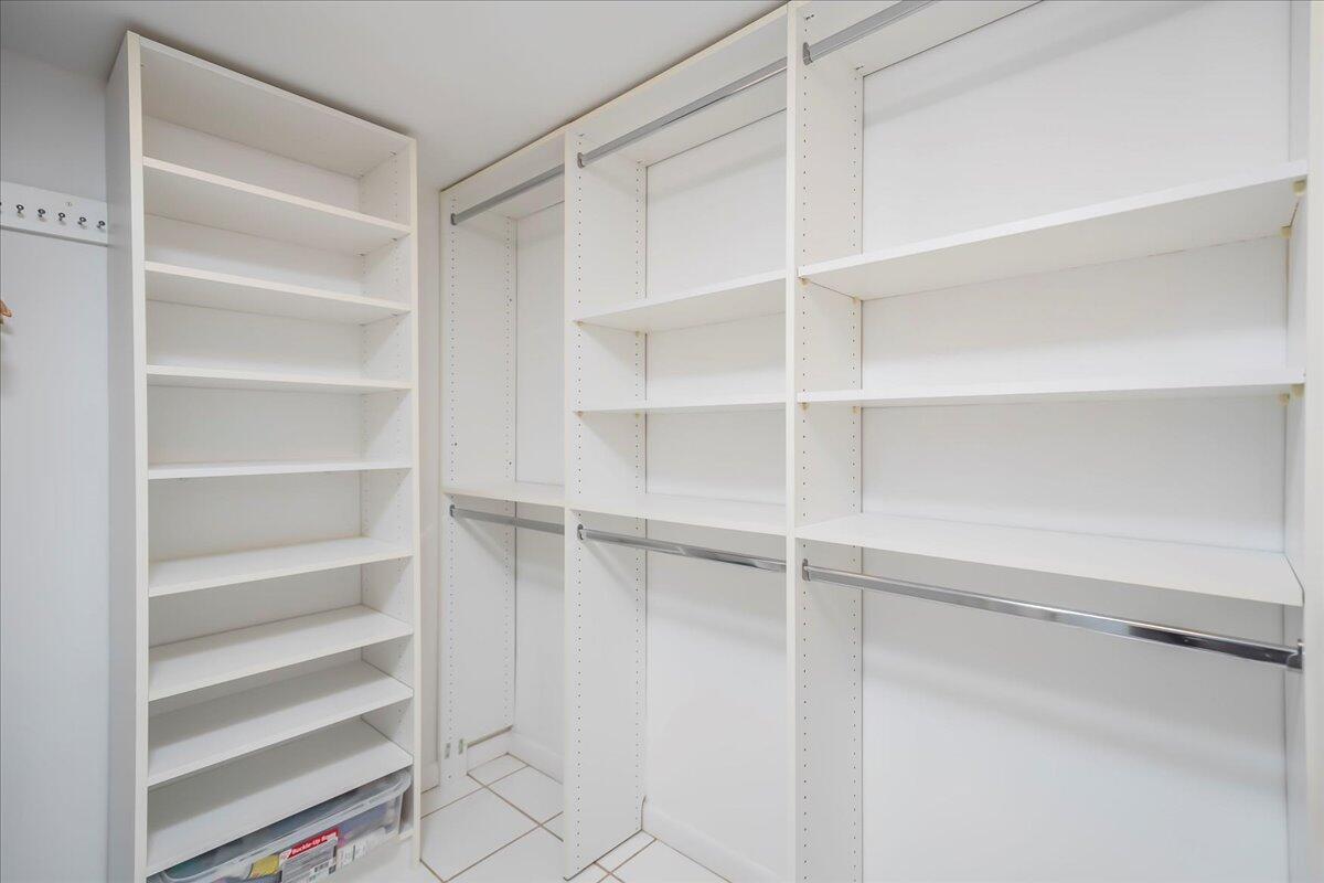 4201 North Ocean Boulevard, Unit 203 Boca Raton, FL 33431 - Photo 10 of 54 a view of walk in closet with empty racks