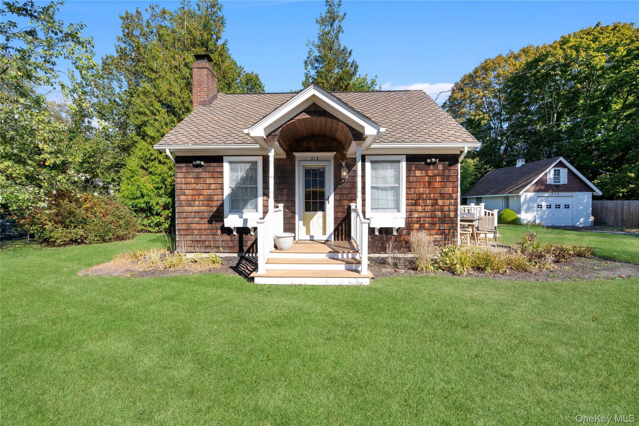 313 Forest Road West Mastic Beach, NY 11951 - Photo 1 of 19 a view of a house with a yard and sitting area