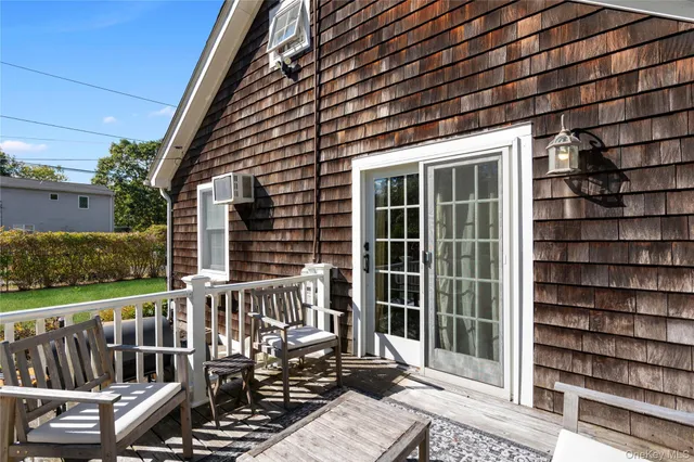 a view of a deck with wooden floor and fence