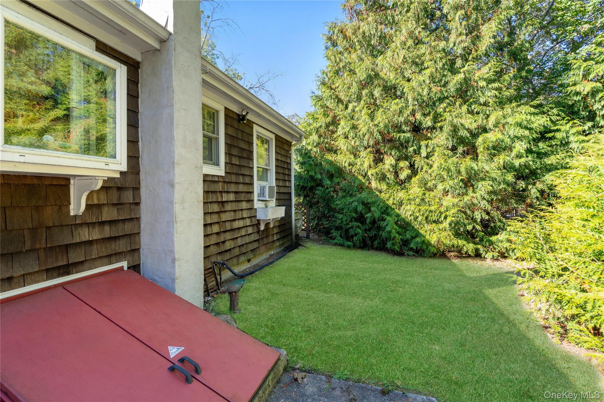 313 Forest Road West Mastic Beach, NY 11951 - Photo 19 of 19 a view of backyard of house with green space