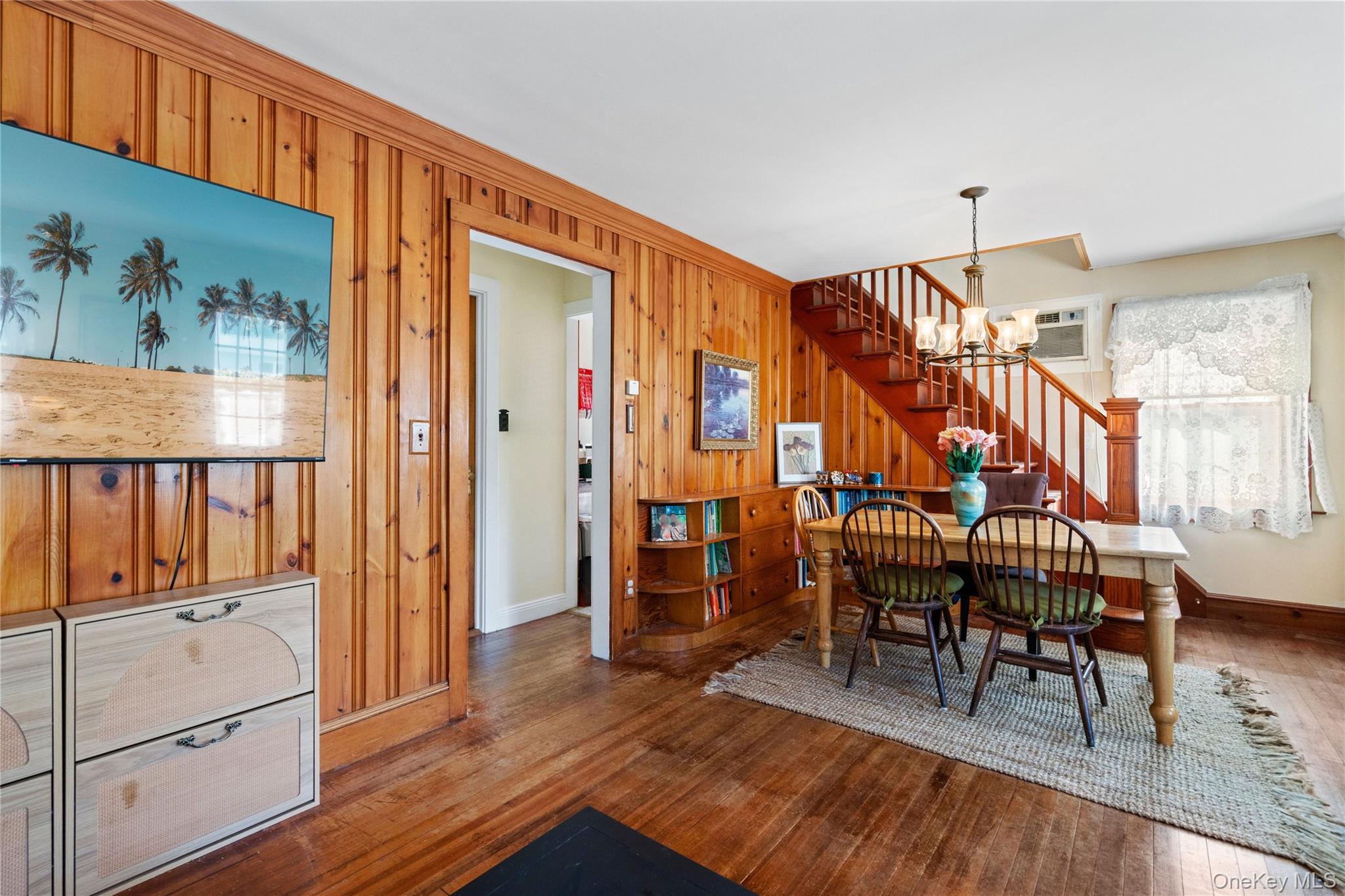 313 Forest Road West Mastic Beach, NY 11951 - Photo 8 of 19 a view of a livingroom with furniture and wooden floor