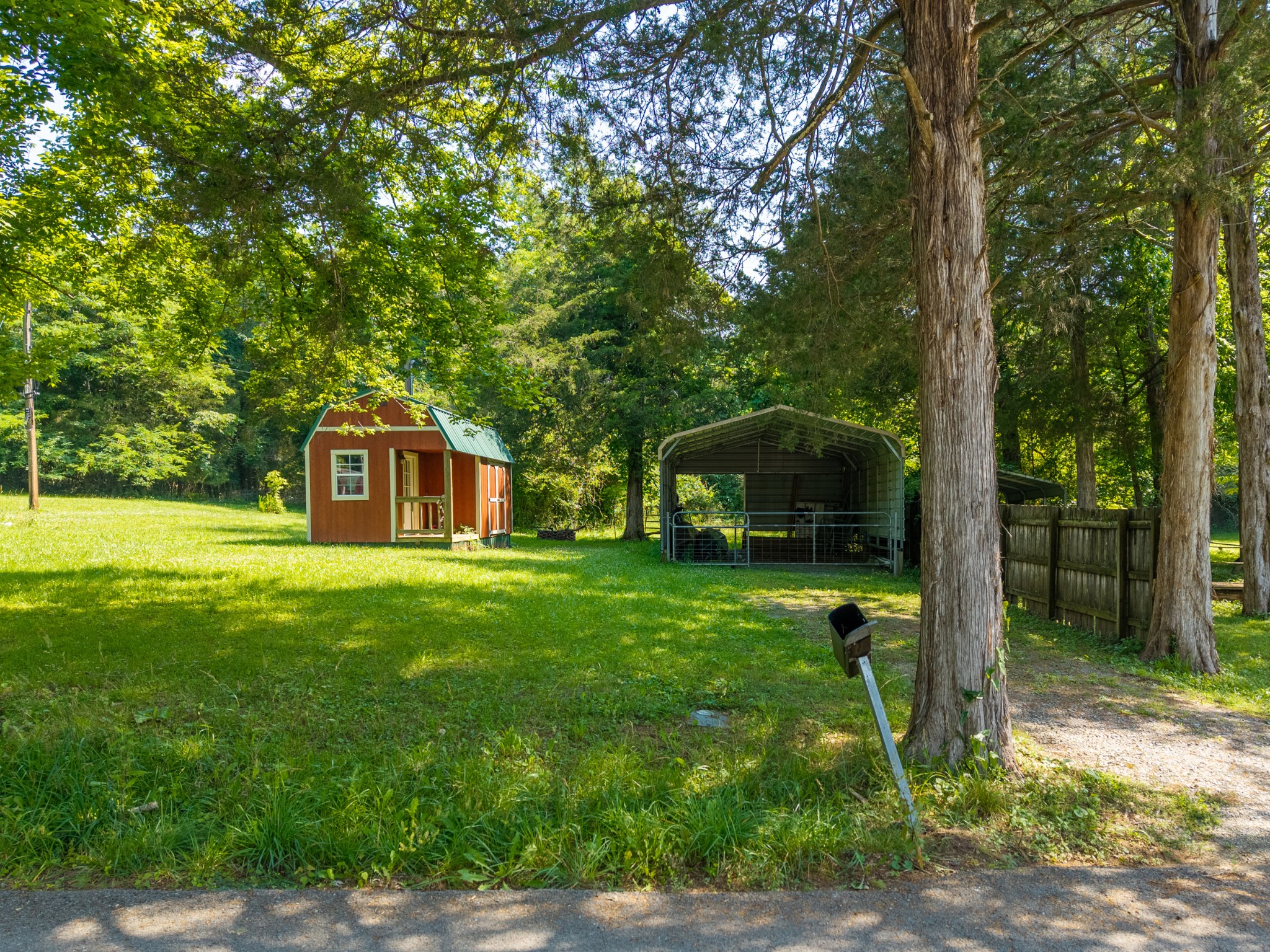 23 Lincoln Lake Road Kelso, TN 37348 - Photo 6 of 11 a front view of a house with a garden