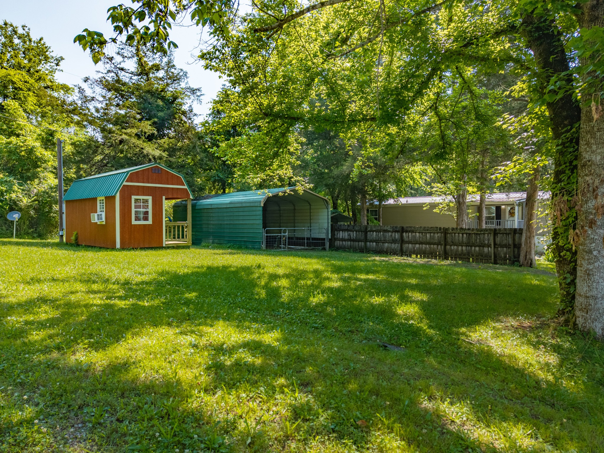 23 Lincoln Lake Road Kelso, TN 37348 - Photo 8 of 11 a front view of a house with yard and green space