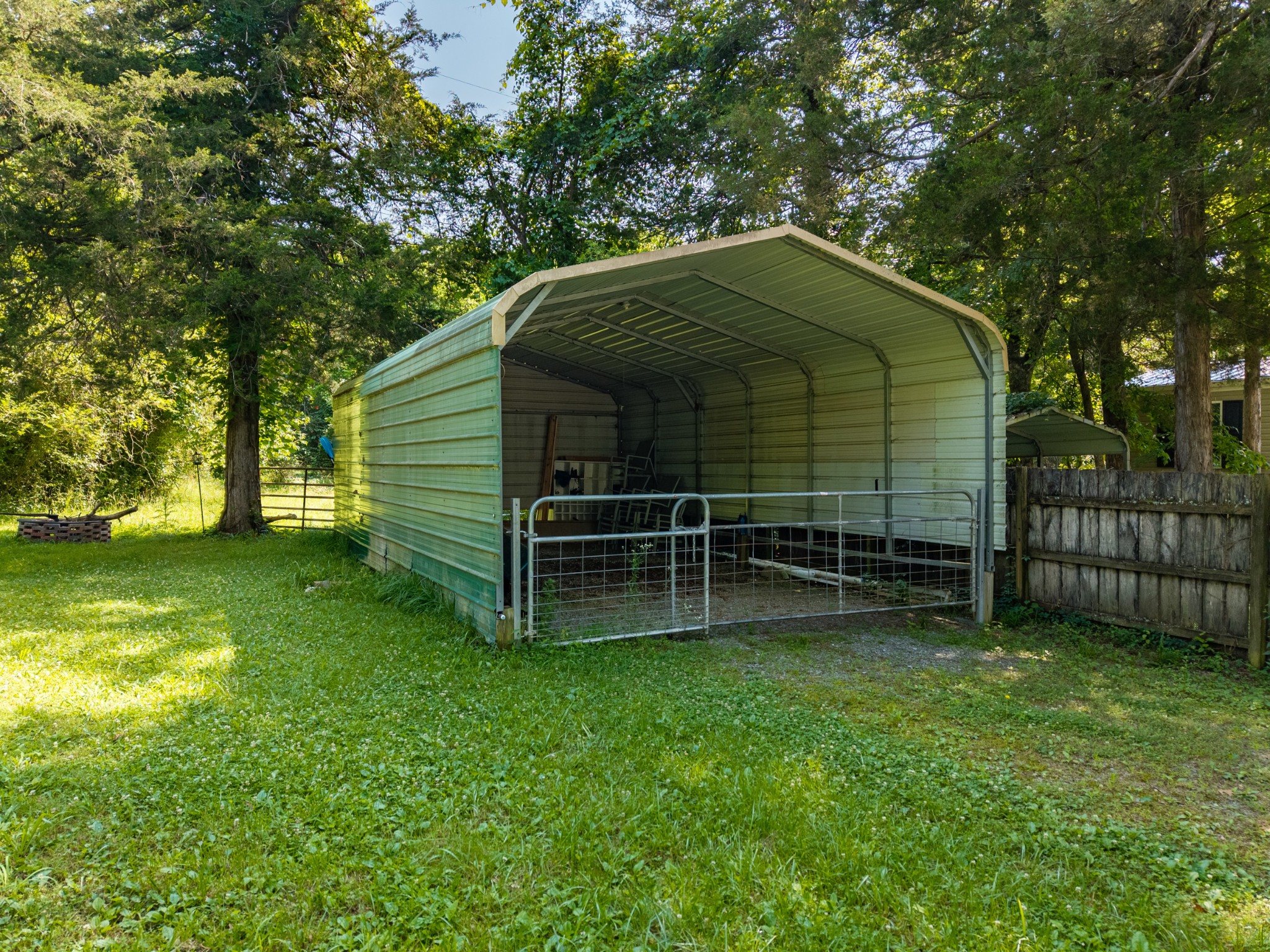 23 Lincoln Lake Road Kelso, TN 37348 - Photo 9 of 11 a view of a backyard with a small cabin