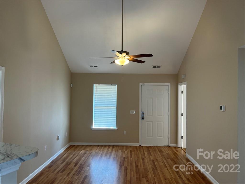 708 South Hoskins Road Charlotte, NC 28208 - Photo 2 of 16 a view of an empty room with window and wooden floor