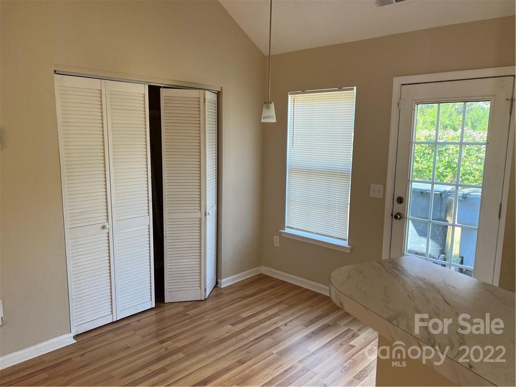 708 South Hoskins Road Charlotte, NC 28208 - Photo 4 of 16 a view of a room with wooden floor and windows