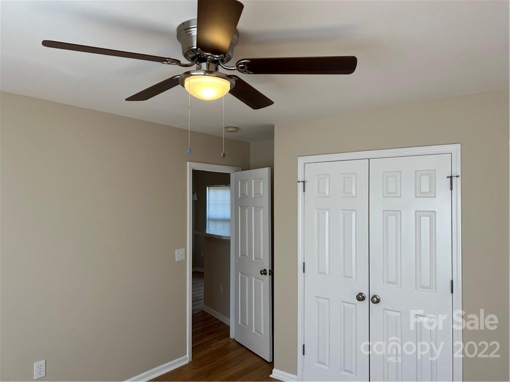 708 South Hoskins Road Charlotte, NC 28208 - Photo 9 of 16 a bedroom with a chandelier