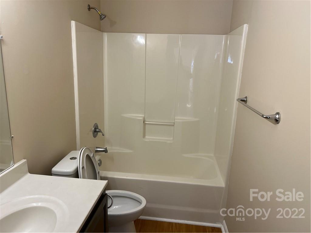 708 South Hoskins Road Charlotte, NC 28208 - Photo 10 of 16 a bathroom with a sink and a bathtub