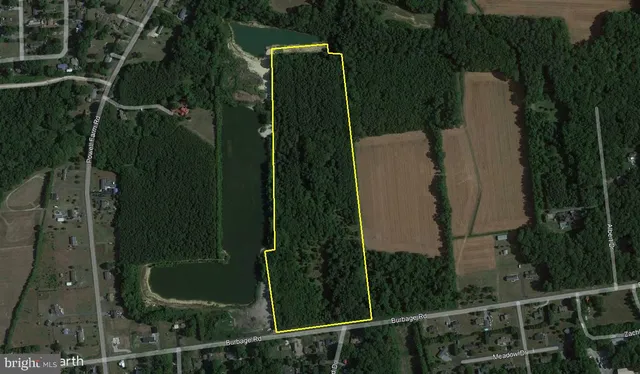 an aerial view of residential house with outdoor space and parking