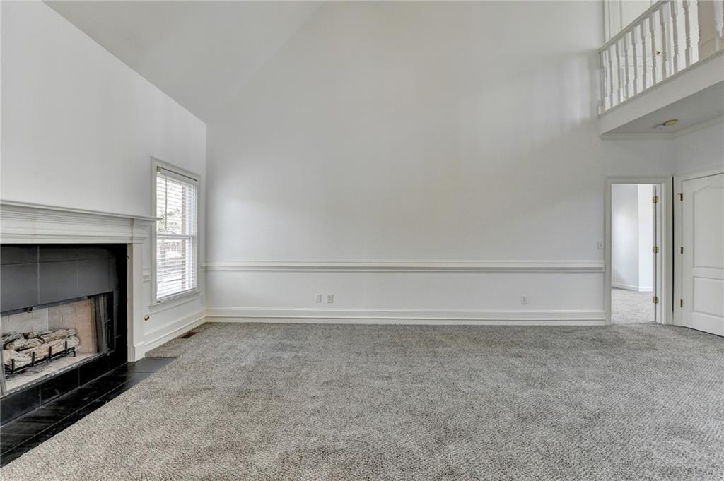 1005 Lewis Ridge Circle Lawrenceville, GA 30045 - Photo 13 of 74 a view of an empty room and a fireplace