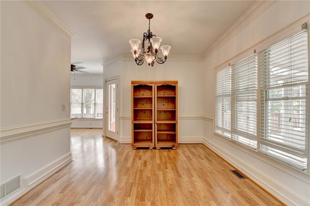 1005 Lewis Ridge Circle Lawrenceville, GA 30045 - Photo 14 of 74 a view of a room with wooden floor and windows