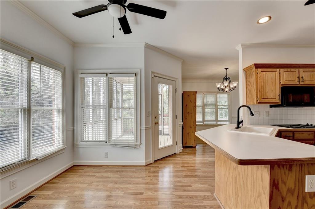 1005 Lewis Ridge Circle Lawrenceville, GA 30045 - Photo 24 of 74 a kitchen with stainless steel appliances granite countertop a sink a stove and a refrigerator