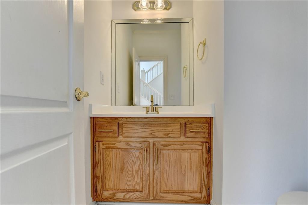 1005 Lewis Ridge Circle Lawrenceville, GA 30045 - Photo 26 of 74 a bathroom with a sink vanity and mirror