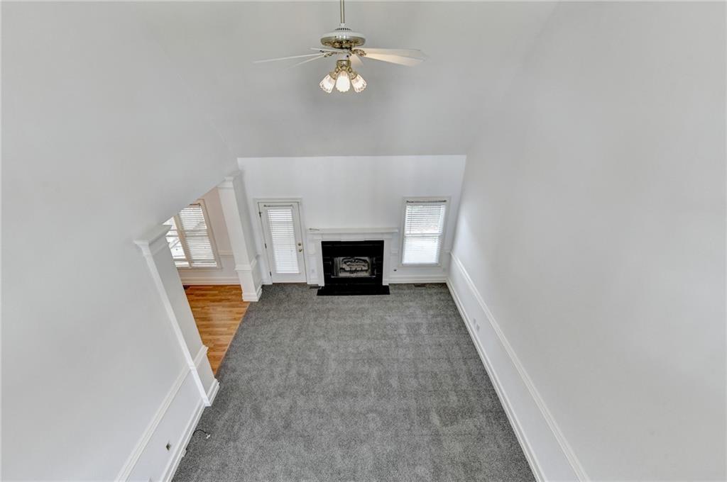 1005 Lewis Ridge Circle Lawrenceville, GA 30045 - Photo 36 of 74 wooden floor in an empty room with a fireplace