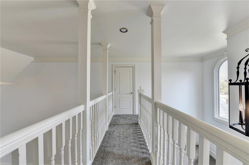 1005 Lewis Ridge Circle Lawrenceville, GA 30045 - Photo 37 of 74 a view of a hallway with wooden floor and entryway