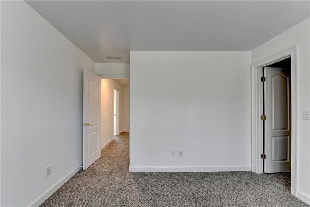 1005 Lewis Ridge Circle Lawrenceville, GA 30045 - Photo 40 of 74 an empty room with closet