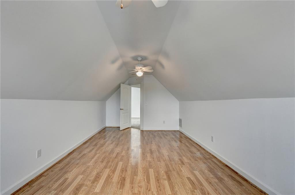 1005 Lewis Ridge Circle Lawrenceville, GA 30045 - Photo 46 of 74 a view of empty room with wooden floor