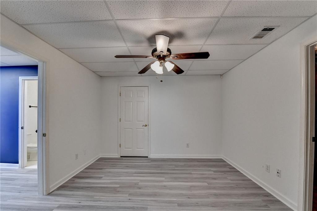 1005 Lewis Ridge Circle Lawrenceville, GA 30045 - Photo 54 of 74 a view of empty room with wooden floor