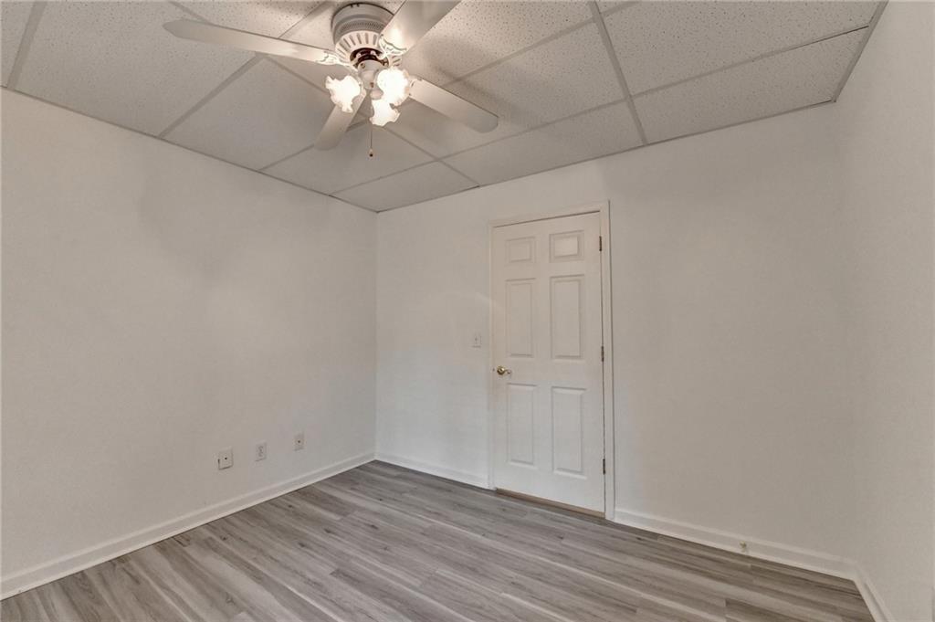1005 Lewis Ridge Circle Lawrenceville, GA 30045 - Photo 56 of 74 wooden floor in an empty room
