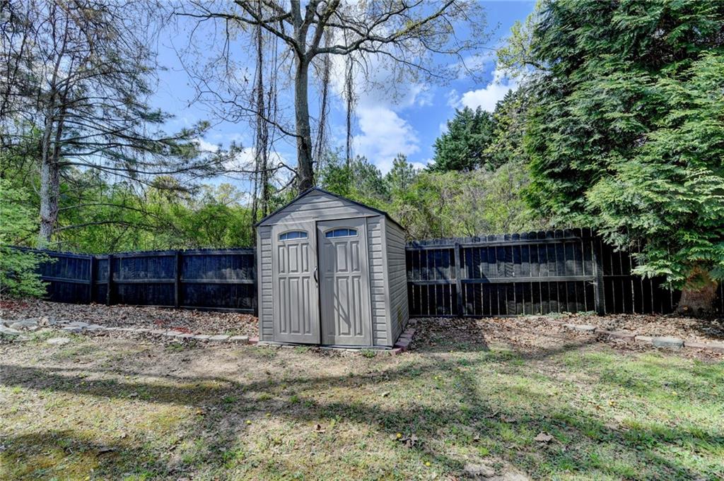 1005 Lewis Ridge Circle Lawrenceville, GA 30045 - Photo 60 of 74 a backyard of a house