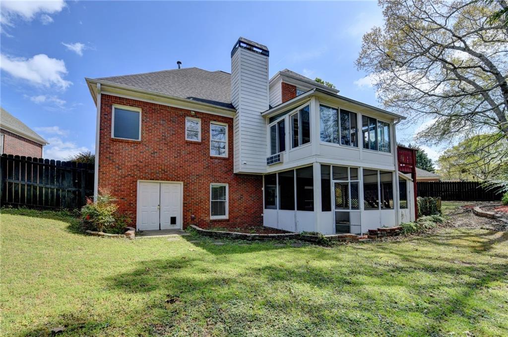 1005 Lewis Ridge Circle Lawrenceville, GA 30045 - Photo 62 of 74 a front view of a house with a garden