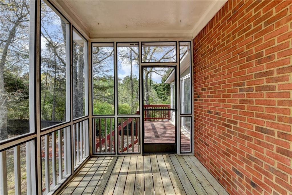 1005 Lewis Ridge Circle Lawrenceville, GA 30045 - Photo 65 of 74 a view of a balcony with wooden floor