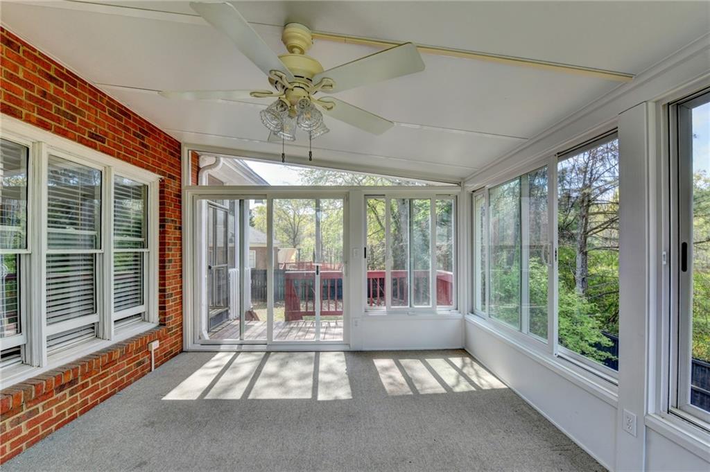 1005 Lewis Ridge Circle Lawrenceville, GA 30045 - Photo 67 of 74 a very nice looking room with a large window and chandelier