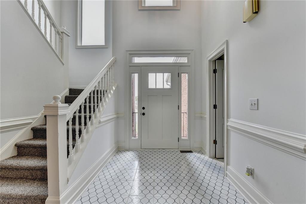 1005 Lewis Ridge Circle Lawrenceville, GA 30045 - Photo 7 of 74 a view of a hallway with entryway and stairs