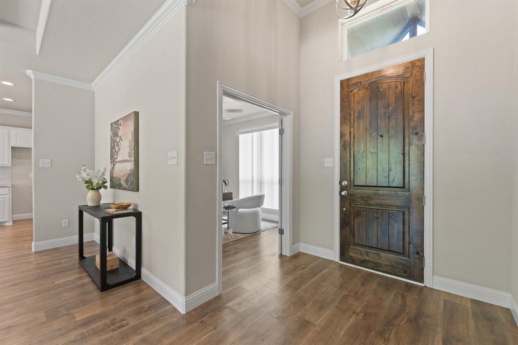 1001 Resolute Road Millsap, TX 76066 - Photo 5 of 40 a view of a hallway and wooden floor a livingroom with wooden floor