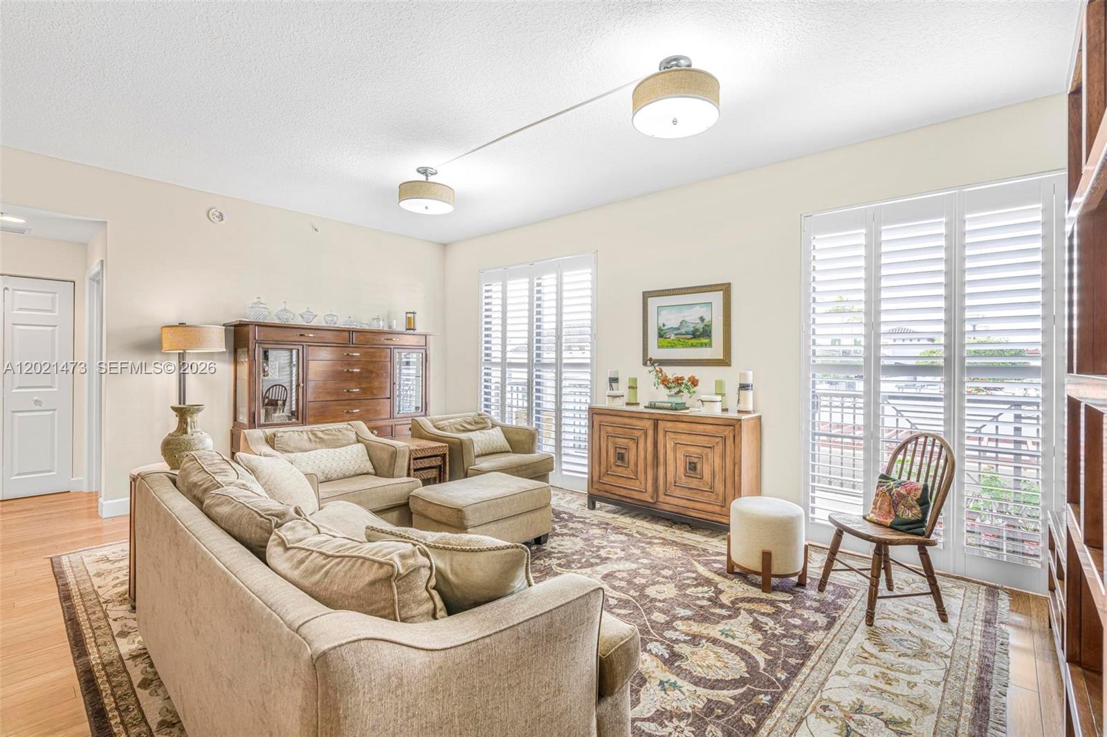 8395 Southwest 73rd Avenue, Unit 710 Miami, FL 33143 - Photo 9 of 32 a living room with furniture and a large window