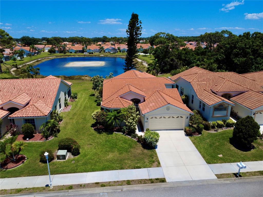 an aerial view of multiple houses with yard