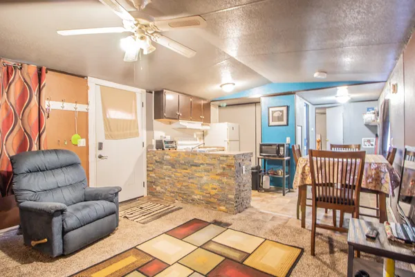 a kitchen with a refrigerator a stove a sink and a refrigerator