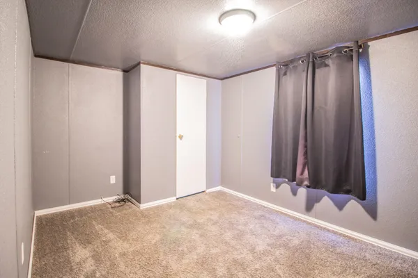 a view of a livingroom with wooden floor