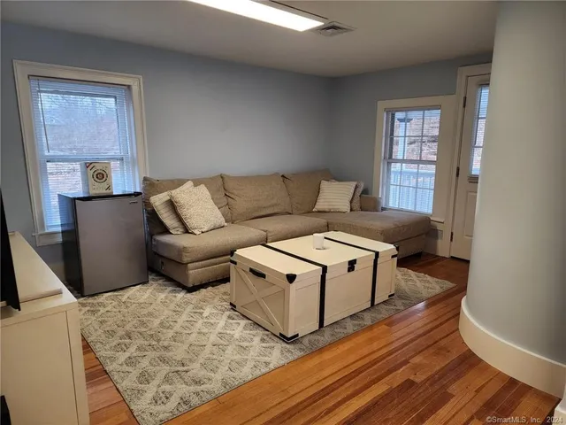 a living room with furniture and a window