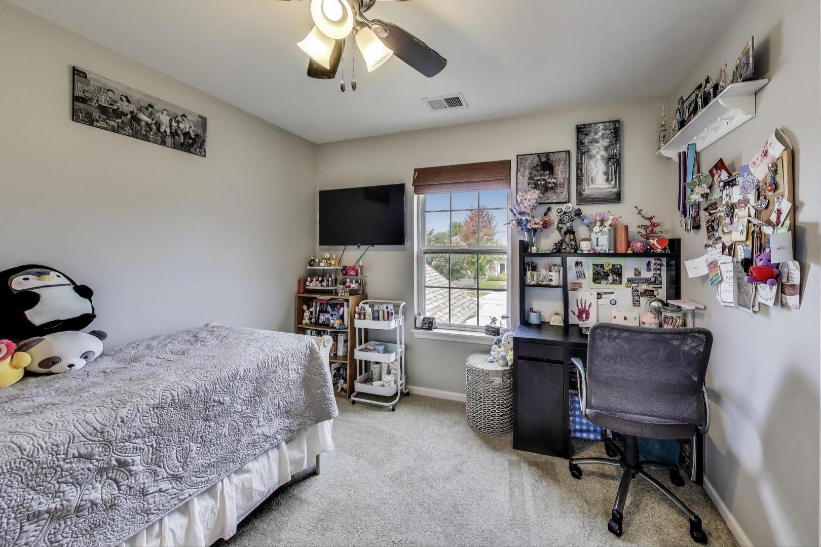 1113 Draper Road McHenry, IL 60050 - Photo 14 of 25 a bedroom with a workspace