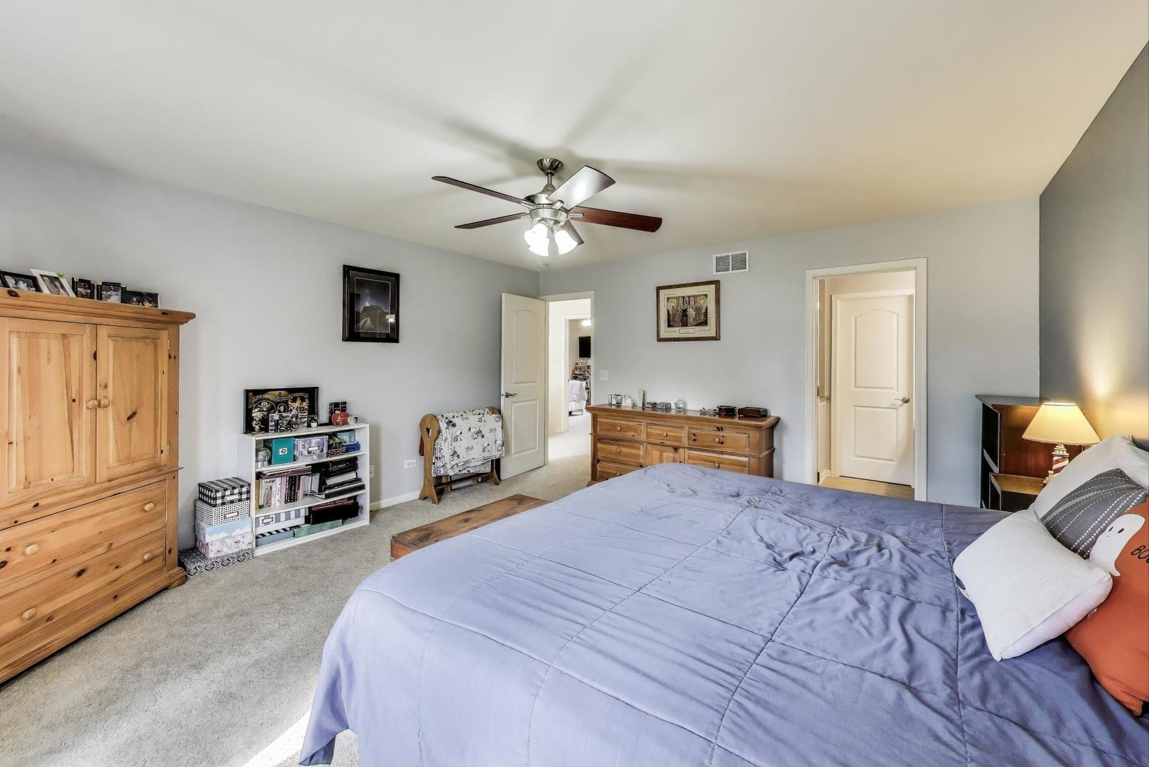 1113 Draper Road McHenry, IL 60050 - Photo 18 of 25 a bedroom with a bed and a couch