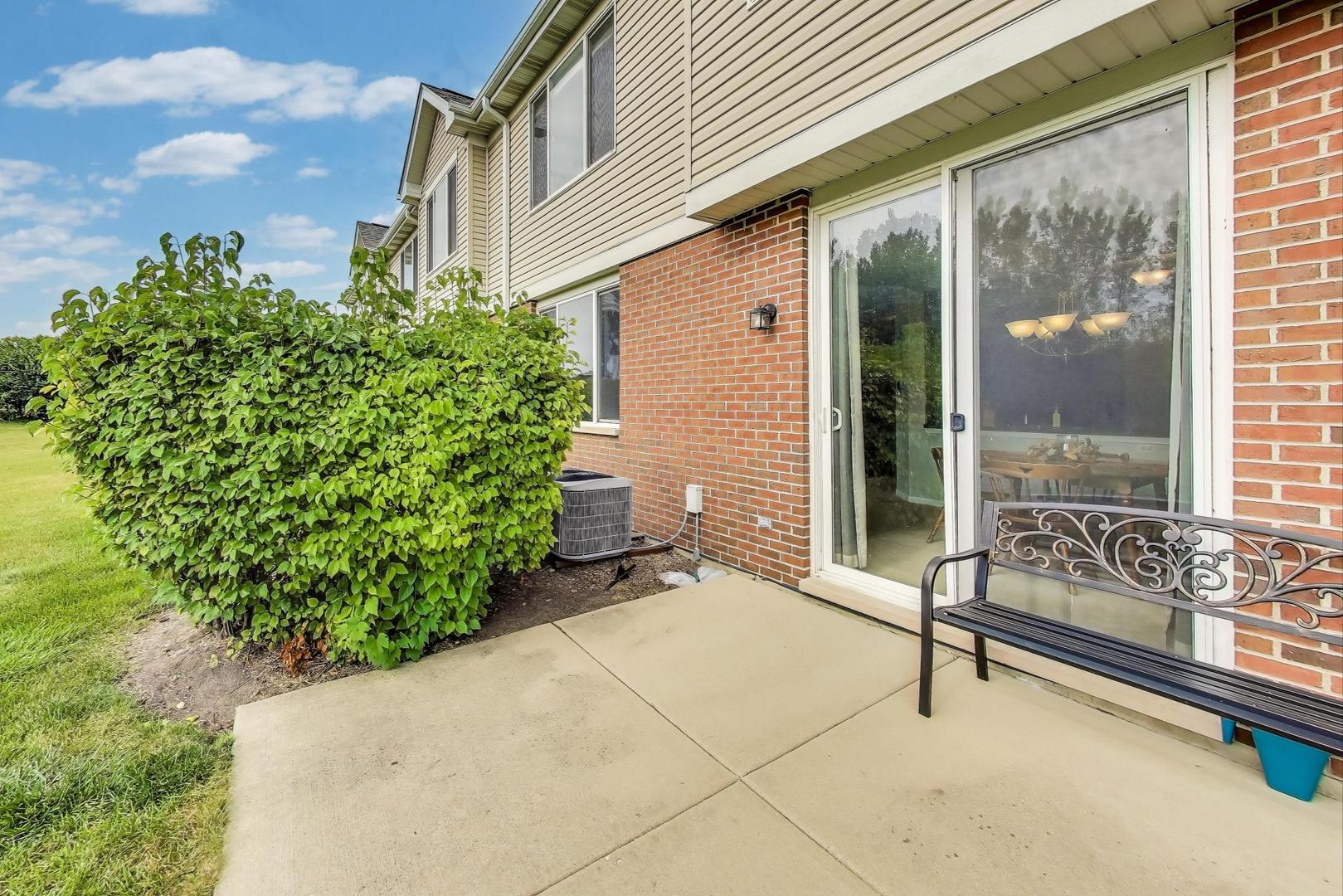 1113 Draper Road McHenry, IL 60050 - Photo 21 of 25 a bench is sitting in front of a house