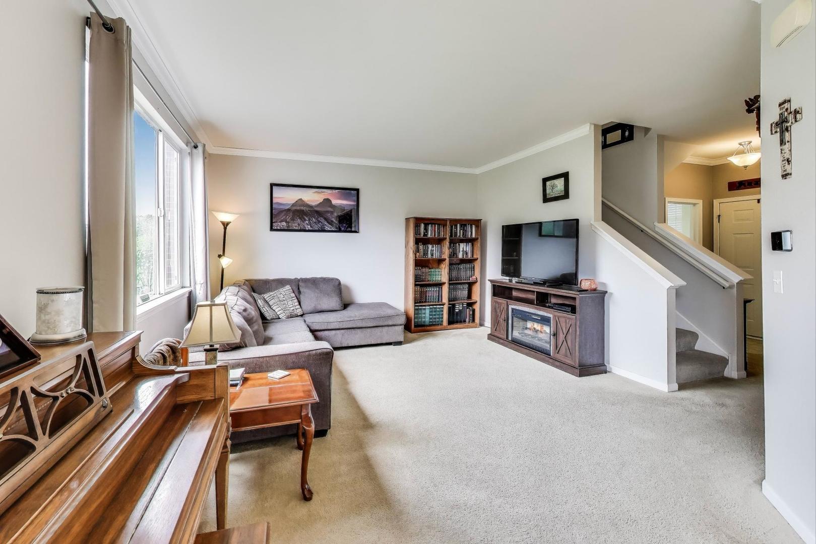 1113 Draper Road McHenry, IL 60050 - Photo 3 of 25 a living room with furniture and a flat screen tv