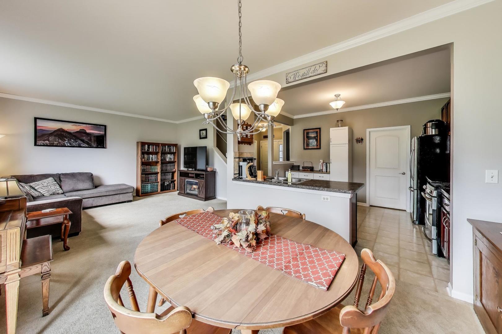 1113 Draper Road McHenry, IL 60050 - Photo 6 of 25 a view of a living room and kitchen