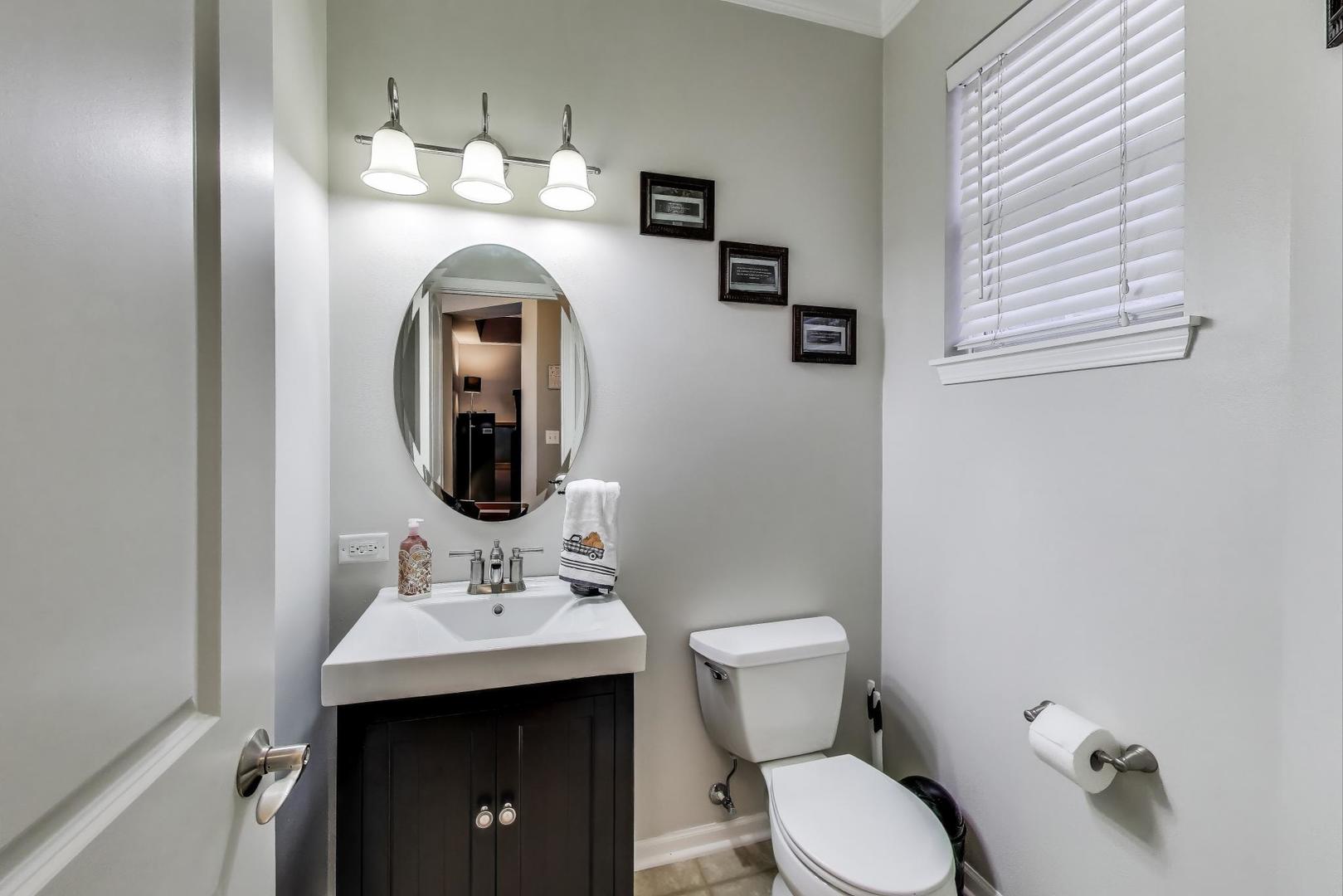 1113 Draper Road McHenry, IL 60050 - Photo 10 of 25 a bathroom with a toilet sink and mirror