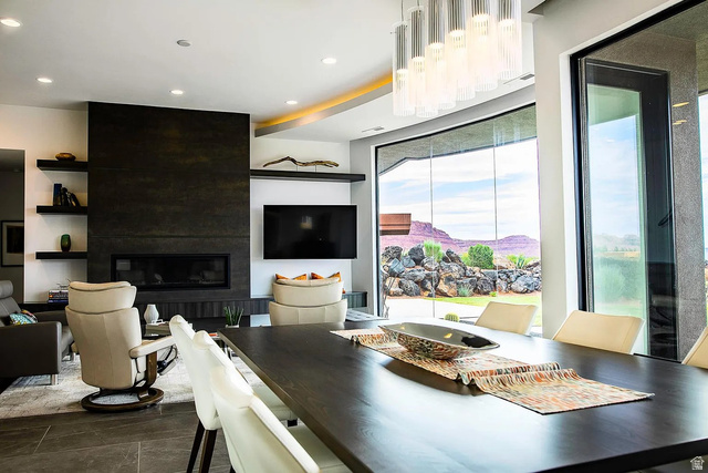 1500 Split Rock, Unit 150 Ivins, UT 84738 - Photo 8 of 14 Spacious interior featuring floor-to-ceiling windows, a linear fireplace with a dark stone-look surround, and recessed lighting