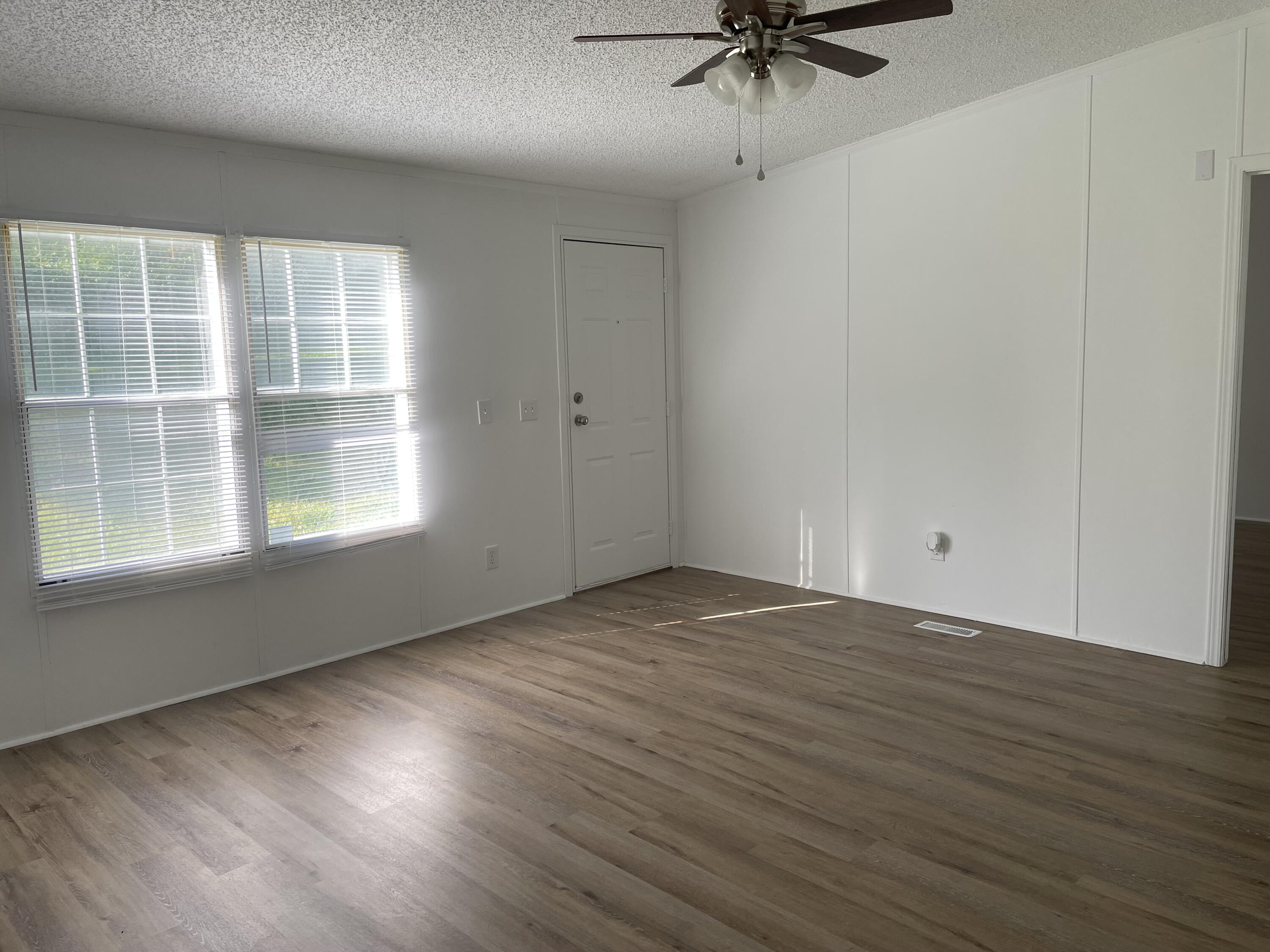 2894 Riverview Road Roanoke, VA 24014 - Photo 2 of 15 wooden floor in an empty room with a window