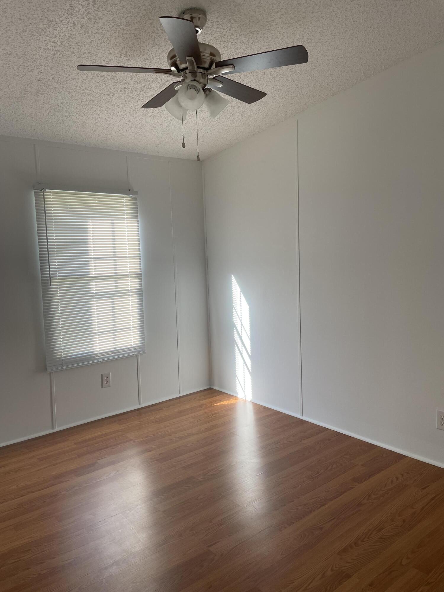 2894 Riverview Road Roanoke, VA 24014 - Photo 11 of 15 a view of an empty room with wooden floor and a window