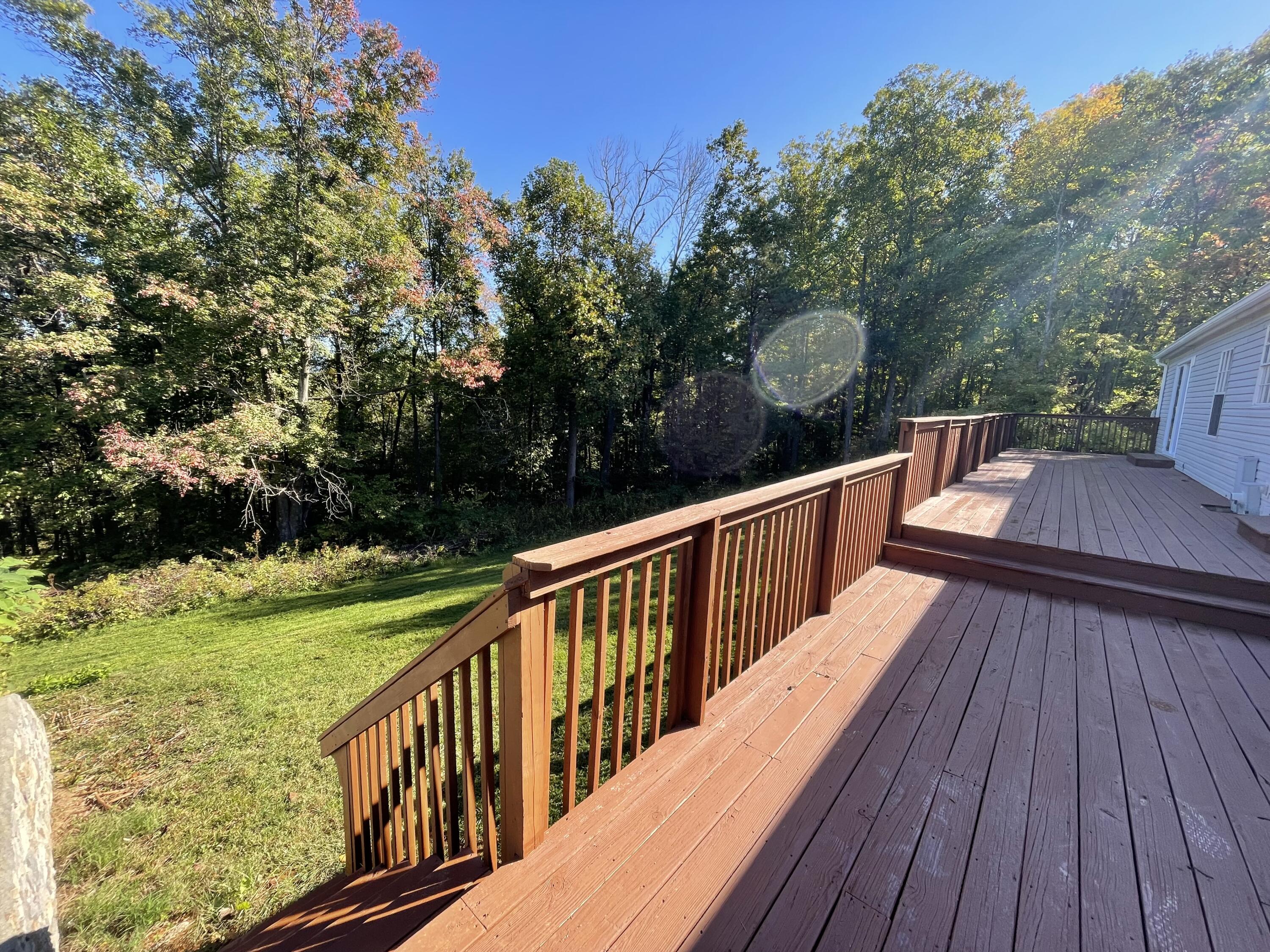 2894 Riverview Road Roanoke, VA 24014 - Photo 12 of 15 a balcony with wooden floor and outdoor seating