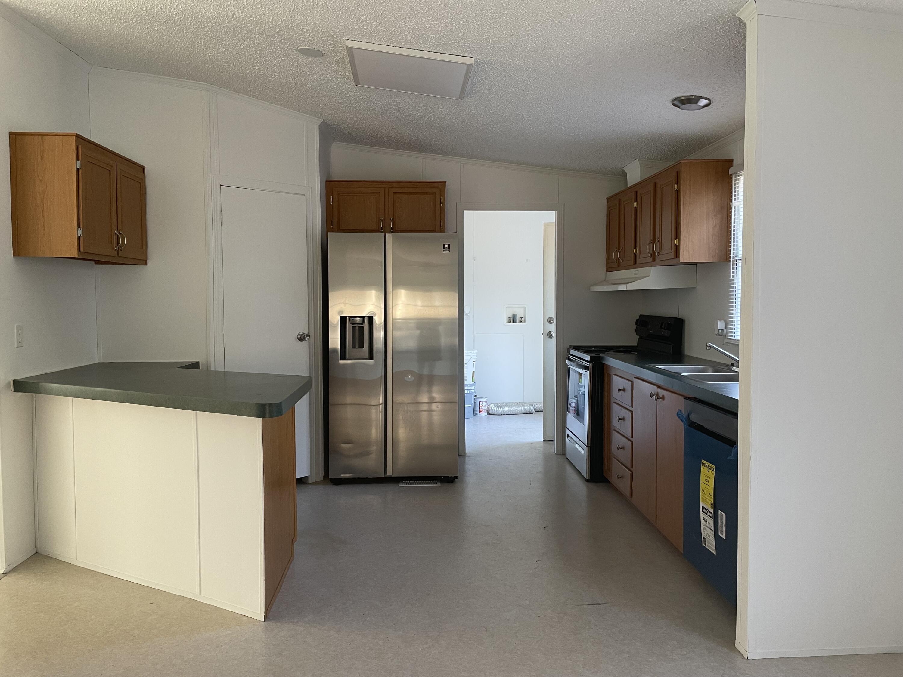 2894 Riverview Road Roanoke, VA 24014 - Photo 5 of 15 a kitchen with stainless steel appliances granite countertop a refrigerator and a stove