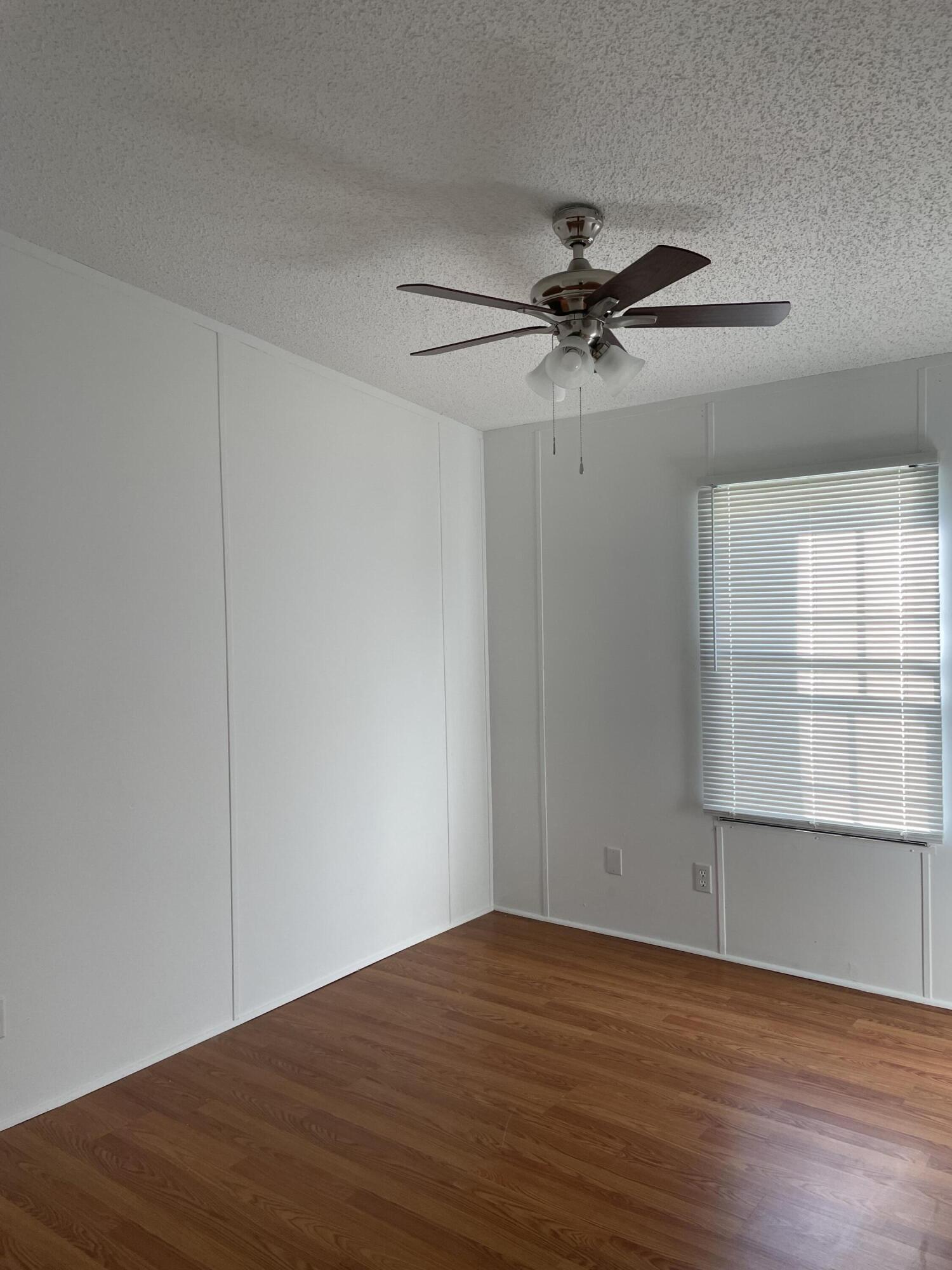 2894 Riverview Road Roanoke, VA 24014 - Photo 9 of 15 a view of a room with wooden floor and a ceiling fan