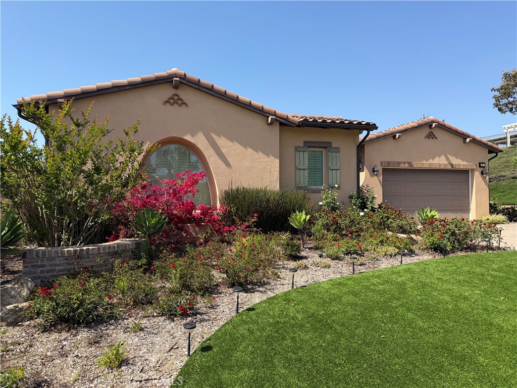 1 Alar Street Rancho Mission Viejo, CA 92694 - Photo 3 of 9 a front view of a house with a garden