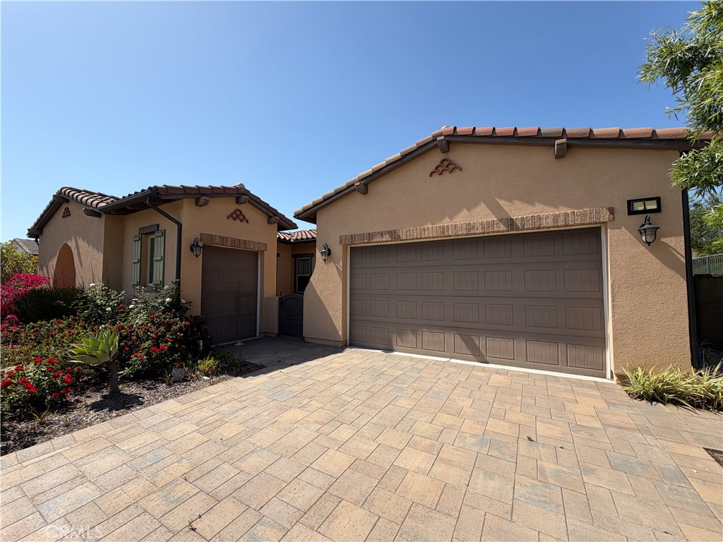 1 Alar Street Rancho Mission Viejo, CA 92694 - Photo 4 of 9 a front view of a house with a garage