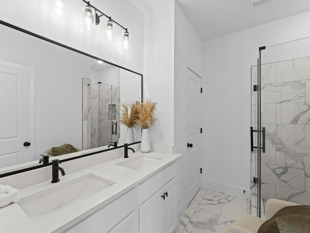 1448 Dewalt Street Houston, TX 77088 - Photo 11 of 24 a bathroom with a sink and mirror with toilet